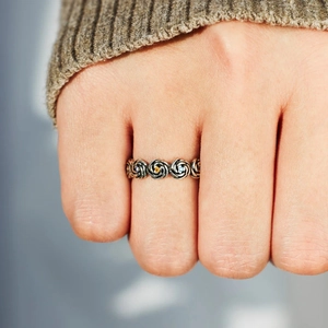 Vintage S925 silver flower ring with colorful zircons worn on hand over sweater