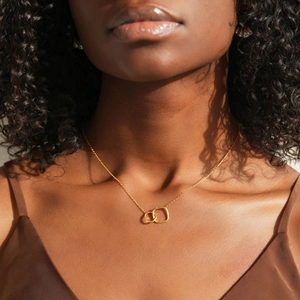 Elegant s925 silver interlocking circle and square pendant necklace on female model