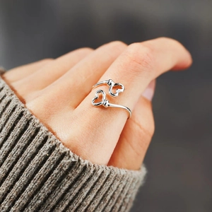 Minimalist S925 sterling silver double heart open ring worn on a finger