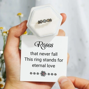 Close-up of retro s925 silver rose ring with colorful crystals in a velvet gift box