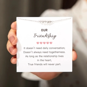 Detail of S925 silver heart bracelet with cubic zirconia on a friendship gift card