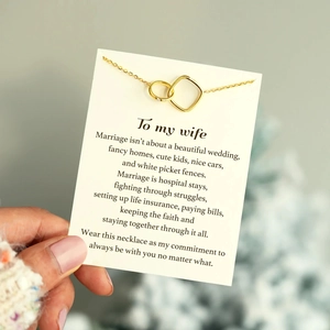 Detail of interlocking circles necklace with a sentimental message card for a wife