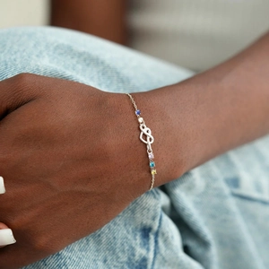 Elegant S925 sterling silver heart knot bracelet with five colorful round gemstones on wrist