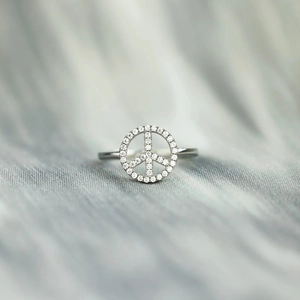 Minimalist s925 silver ring featuring a sparkling zircon-encrusted peace sign symbol