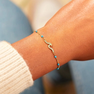 S925 sterling silver wave bracelet with blue enamel and turquoise beads on woman wrist