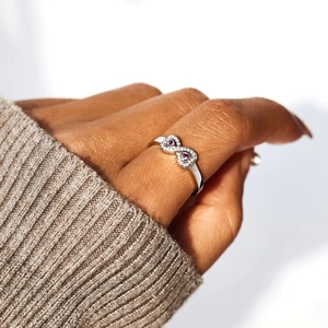 Infinity s925 silver ring featuring pink heart gemstones and white zircon accents