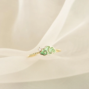 S925 silver gold-plated ring featuring green enamel clouds and accent diamond detailing