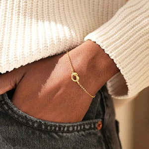 Elegant 925 sterling silver gold-plated knot bracelet on a female model wrist