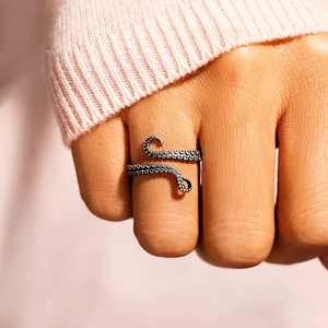 Adjustable S925 sterling silver octopus ring with realistic tentacle texture on a finger