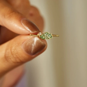 Detailed close-up of S925 silver ring featuring a green enamel cloud and tiny gemstone