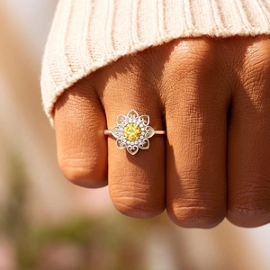 S925 sterling silver mandala flower ring with central yellow gemstone on hand
