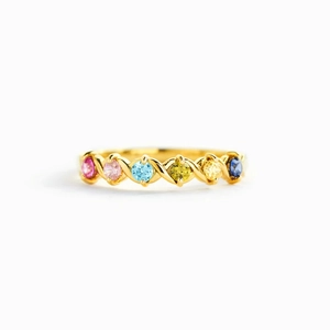 Braided gold ring with six round colorful rainbow gemstones on a clean white background