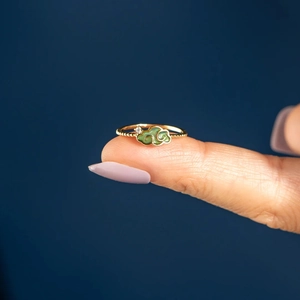 Macro shot of s925 silver cloud ring with green enamel and tiny zircon detail