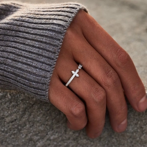 S925 sterling silver cross ring with pavé-set zircon worn on hand outdoors