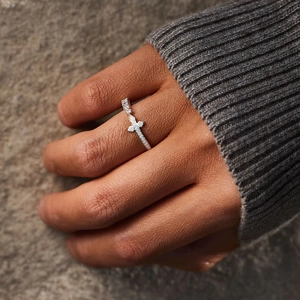 Minimalist S925 sterling silver cross ring with pavé zircon stones on a model's finger