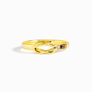 Golden S925 sterling silver knot ring featuring four multicolored birthstones on white background