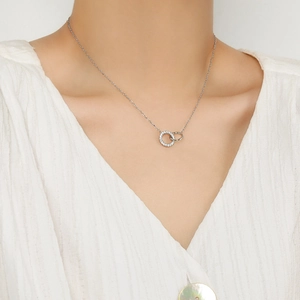 Elegant S925 sterling silver interlocking double ring necklace worn by a female model