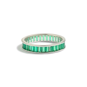 Macro detail of S925 sterling silver ring with emerald green rectangular zircon stones