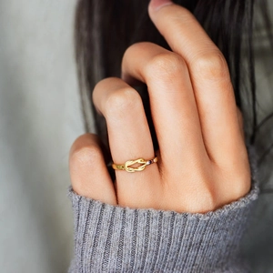 Elegant s925 silver knot ring with colorful birthstones shown on a hand