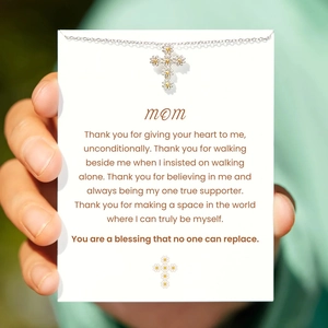 S925 sterling silver daisy cross necklace displayed on a heartfelt white greeting card