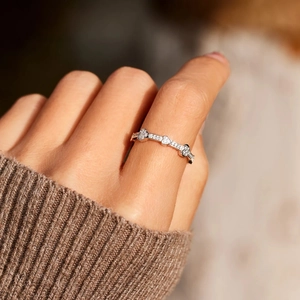 S925 sterling silver ring with three micro-pave heart-shaped zircons on model hand