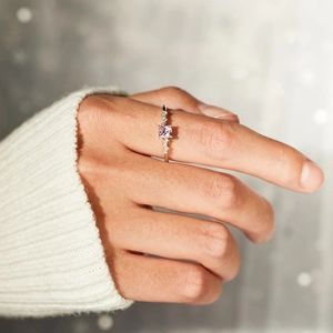 Elegant S925 silver ring featuring a square pink zircon center stone on a model hand