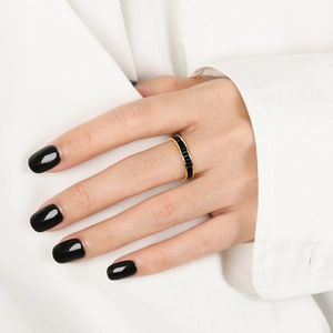 Gold s925 silver ring with rectangular black zircon stones shown on a finger