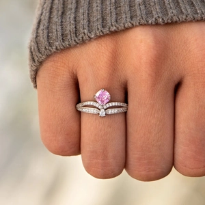 Elegant S925 sterling silver double-layered crown ring with pink gemstone on female finger