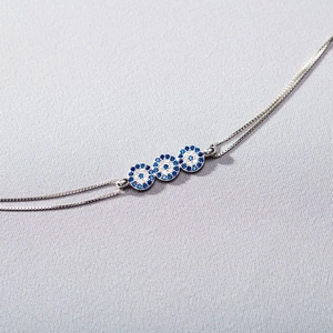 Bracciale minimalista in argento sterling S925 con occhio del diavolo e cristalli blu