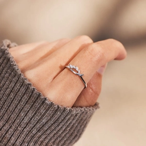 Elegant S925 sterling silver knot ring with marquise zircon leaves worn on finger