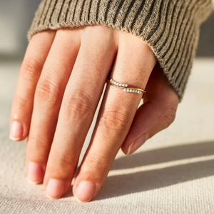 S925 sterling silver wave ring with double-row micro-set diamonds on model's hand