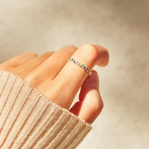 Minimalist S925 sterling silver ring with multi-color cubic zirconia on a model hand