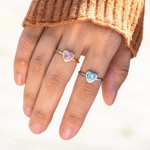 Minimalist S925 sterling silver heart rings with pink and blue enamel detailing on hands