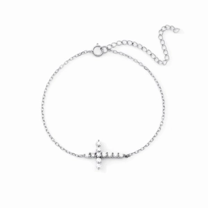Minimalist S925 sterling silver cross bracelet with pavé-set zircons on a white background