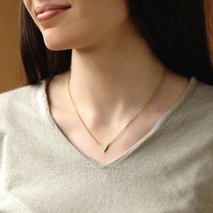 Elegant gold triangle opal necklace for women worn on neck with a minimalist style