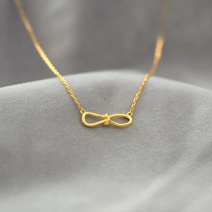 Golden S925 sterling silver infinity knot necklace with delicate link chain for women