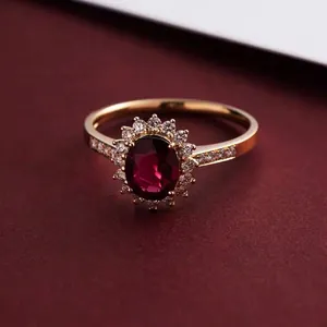 Luxurious S925 silver ring featuring a large oval red zircon in a sunflower halo design