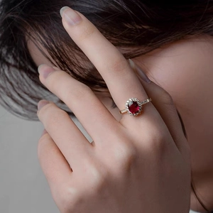 Elegant S925 silver ring with red sunflower zircon stone worn by a model