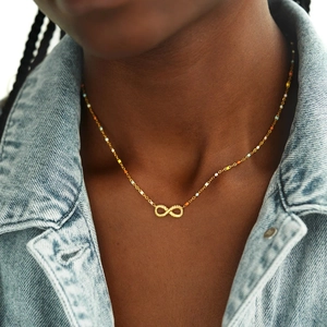 S925 silver golden infinity necklace with colorful beads on a female model