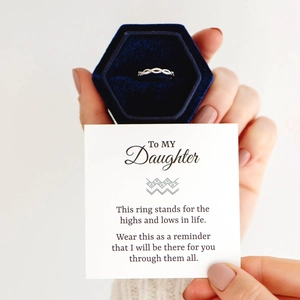Close-up of S925 sterling silver infinity ring in blue velvet box with gift message
