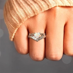 Elegant S925 sterling silver opal heart ring with zircon inlay on a finger