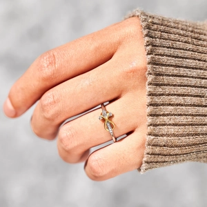 S925 silver infinity cross ring with diamonds on model in warm lifestyle setting