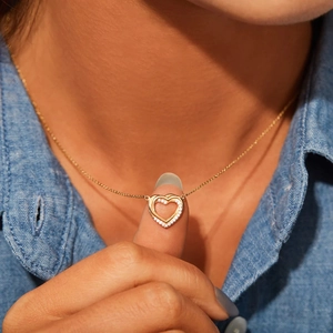 Elegant s925 silver double heart pendant necklace with shimmering zircon stones and gold finish