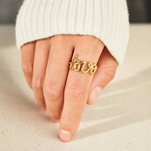 Minimalist S925 sterling silver gold LOVE letter open ring shown on a model's hand
