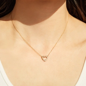 Minimalist S925 sterling silver necklace featuring double hollow heart pendant with zircons
