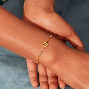 S925 silver gold-plated infinity symbol bracelet with colorful beads on wrist