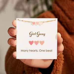 Detail of s925 silver gradient enamel heart bracelet with Girl Gang card display