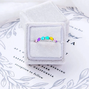 S925 silver ring with seven colorful enamel hearts presented in a velvet jewelry box