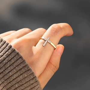 Elegant gold S925 sterling silver ring featuring a sparkling cross with tiny crystals