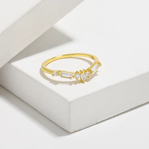 Macro view of S925 sterling silver crown ring with gold plating and clear zircon stones